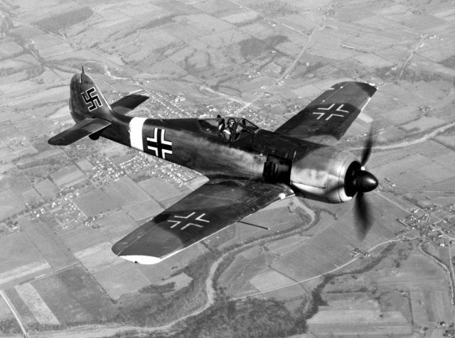 A captured Fw 190A-4. The USAAF-painted Balkenkreuz and swastika markings are of nonstandard size and proportions